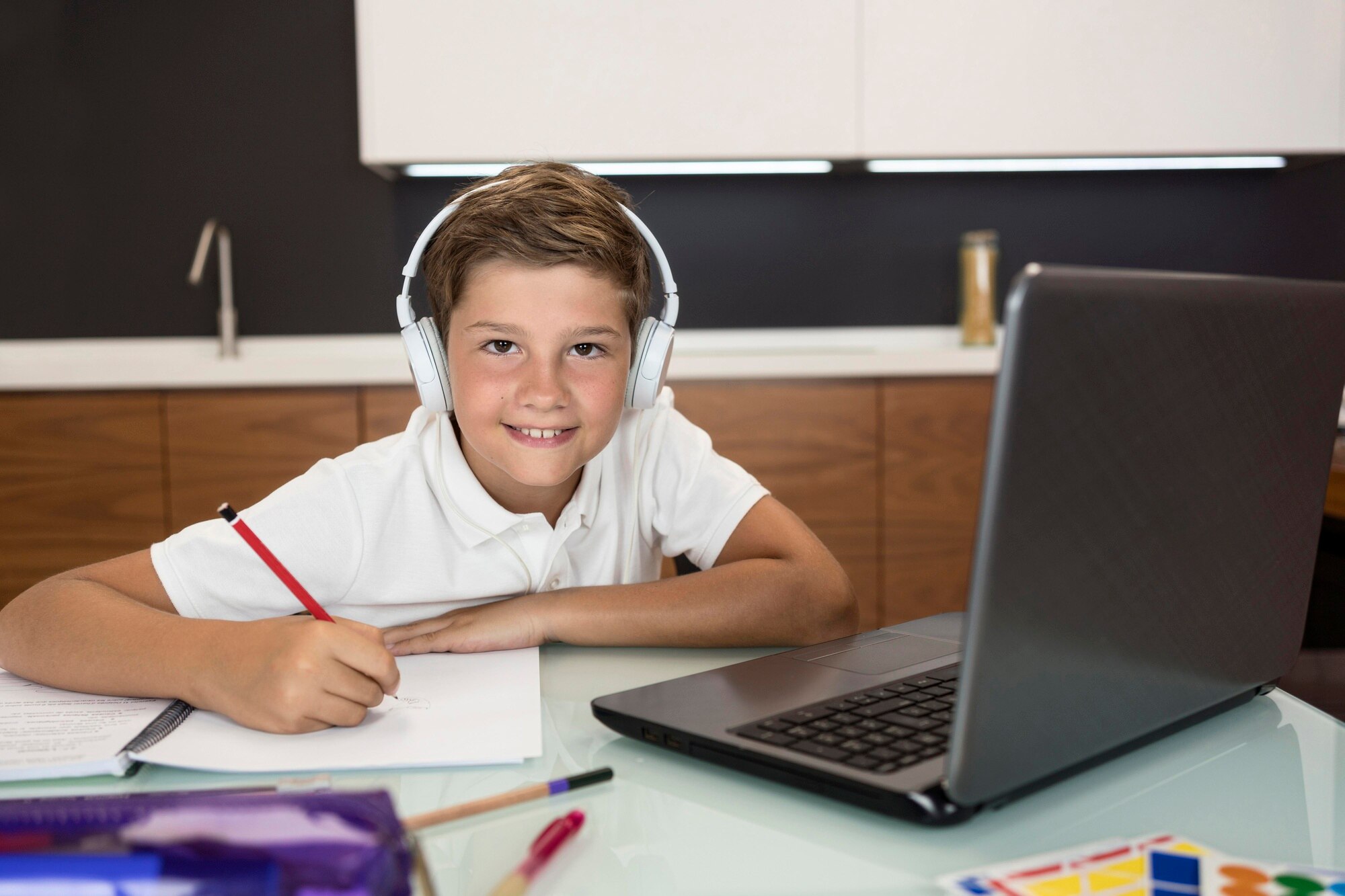 adorable-young-boy-doing-his-homework_23-2148622786