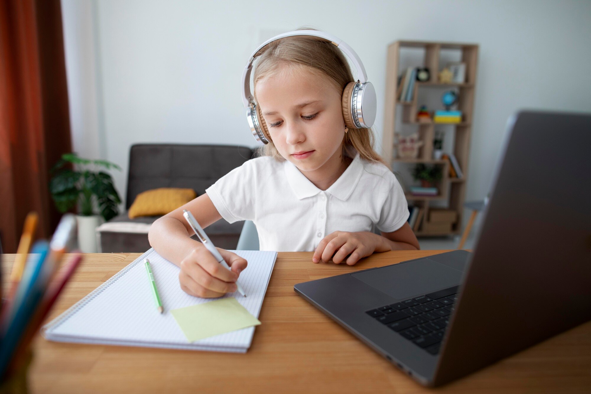 little-girl-doing-online-classes-from-home_23-2149041070