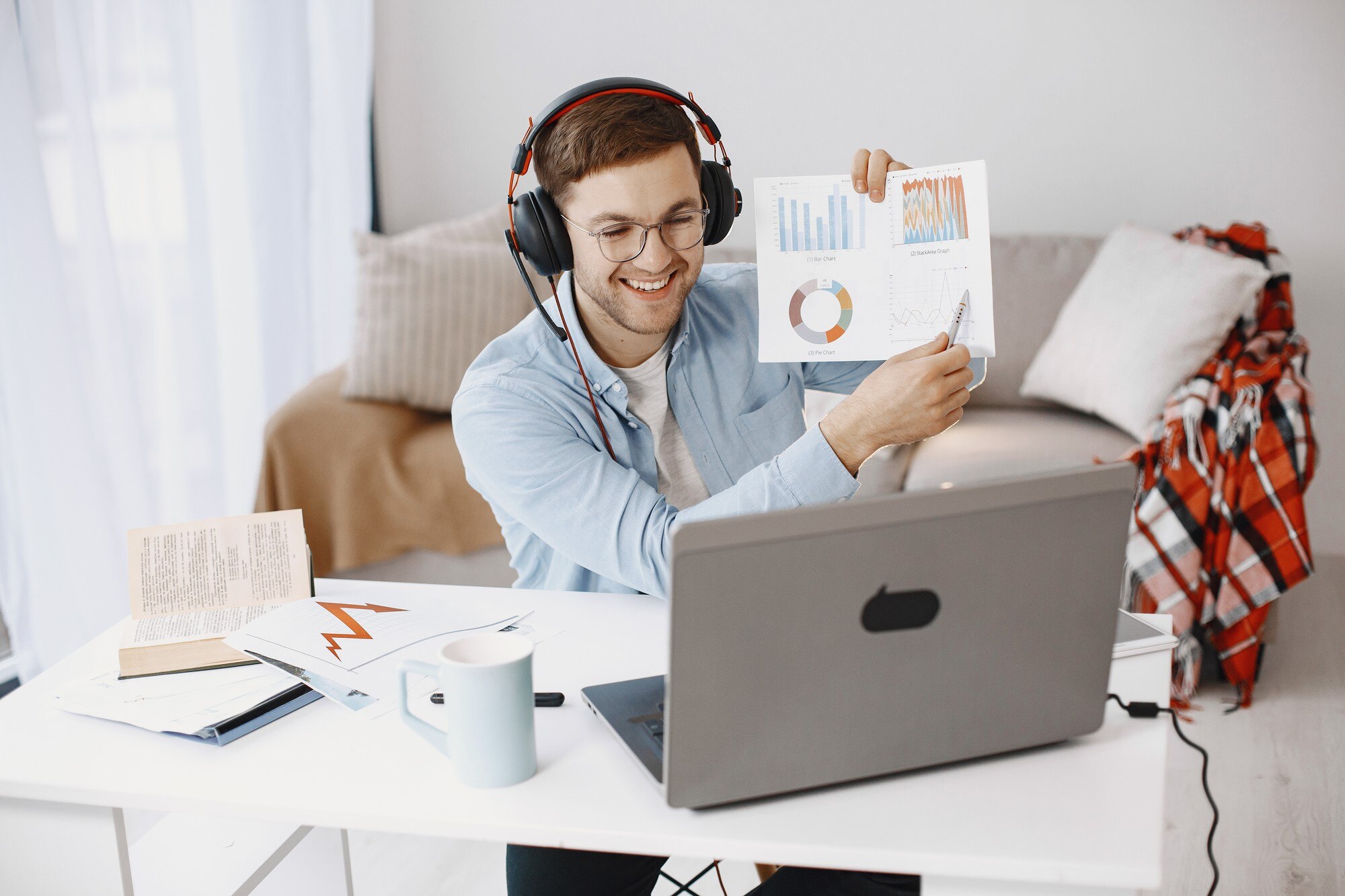 man-sitting-living-room-home-guy-enjoying-studying-using-laptop-headset_1157-48714