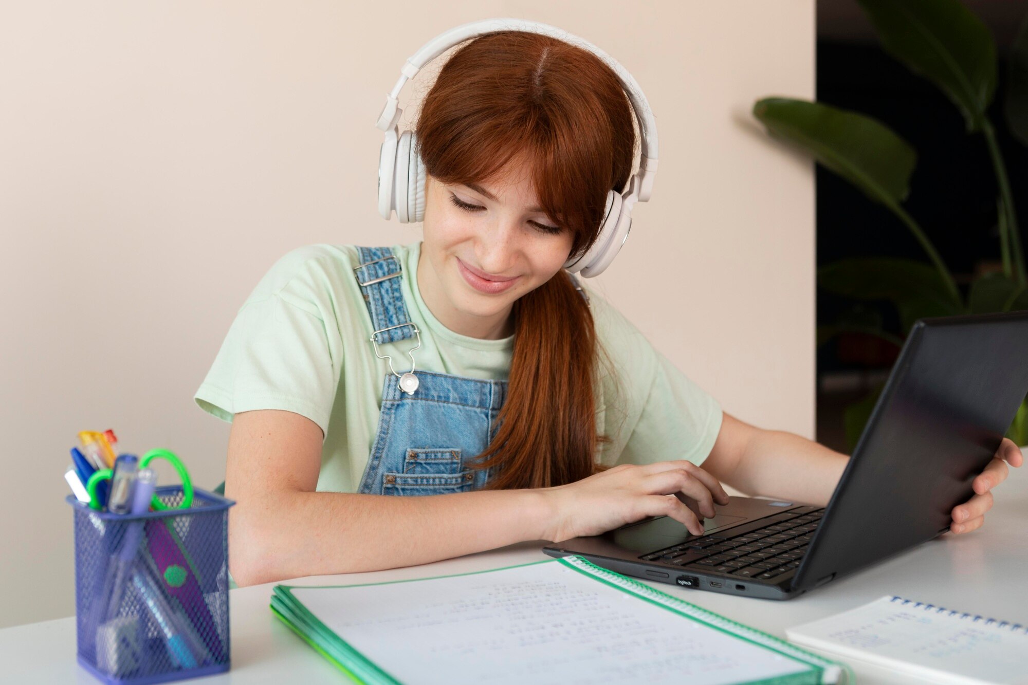 medium-shot-girl-with-laptop-home_23-2149014092