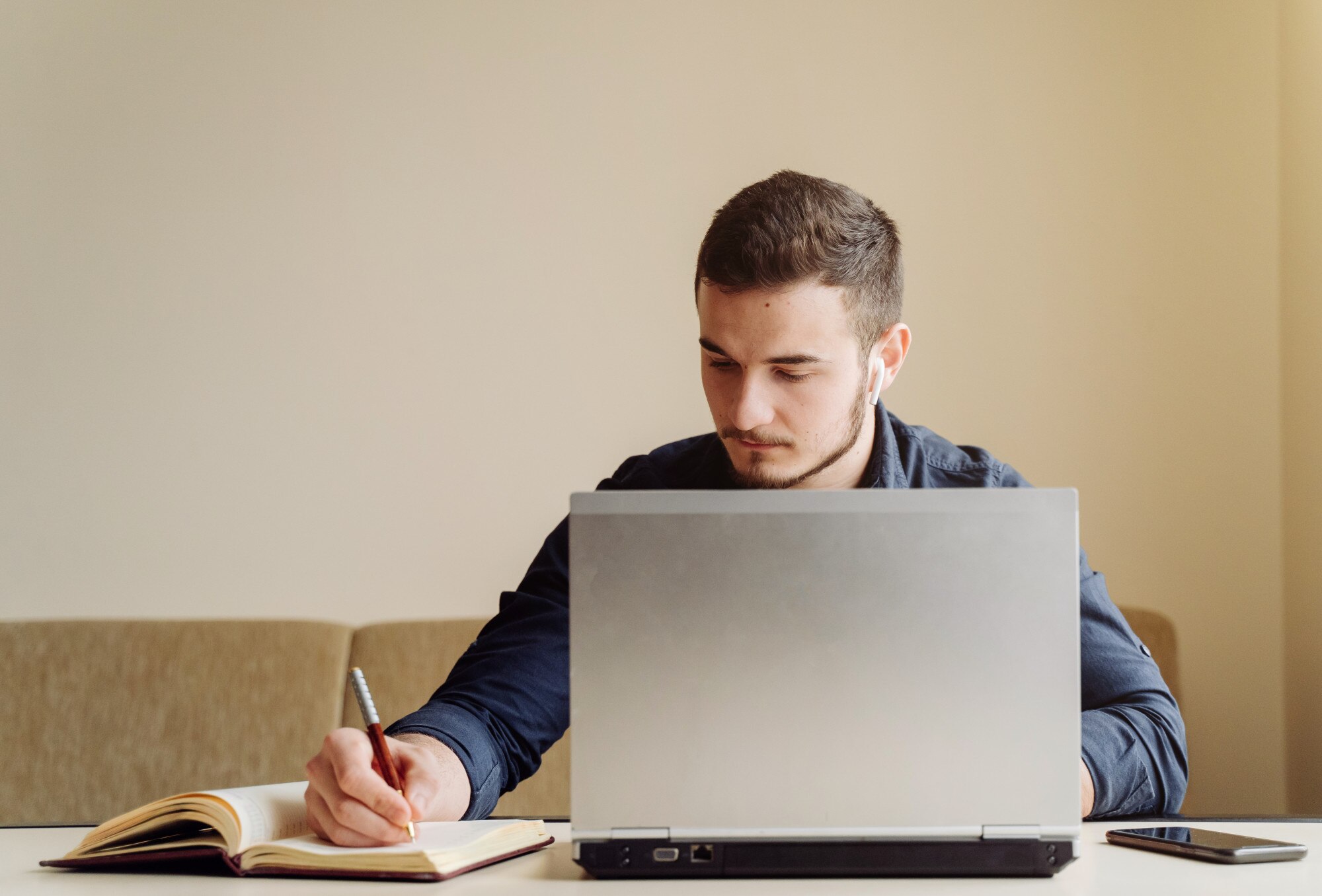 young-businessman-working-with-computer-remotely_1328-3388